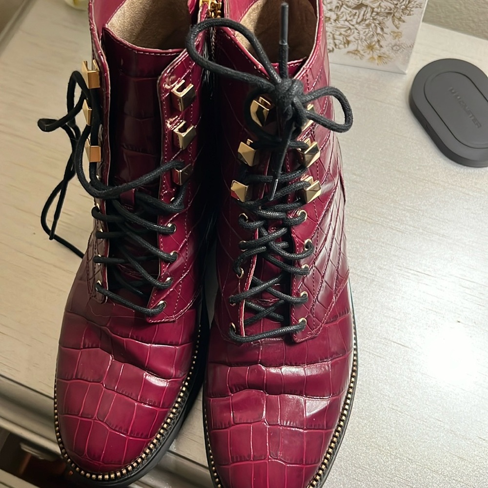 Michael Kors embossed croc leather combat boots.
